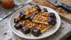 Nussstangen mit Cashews und Orangen-Gelee – saftig, karamellig und mit dunkler Kuvertüre